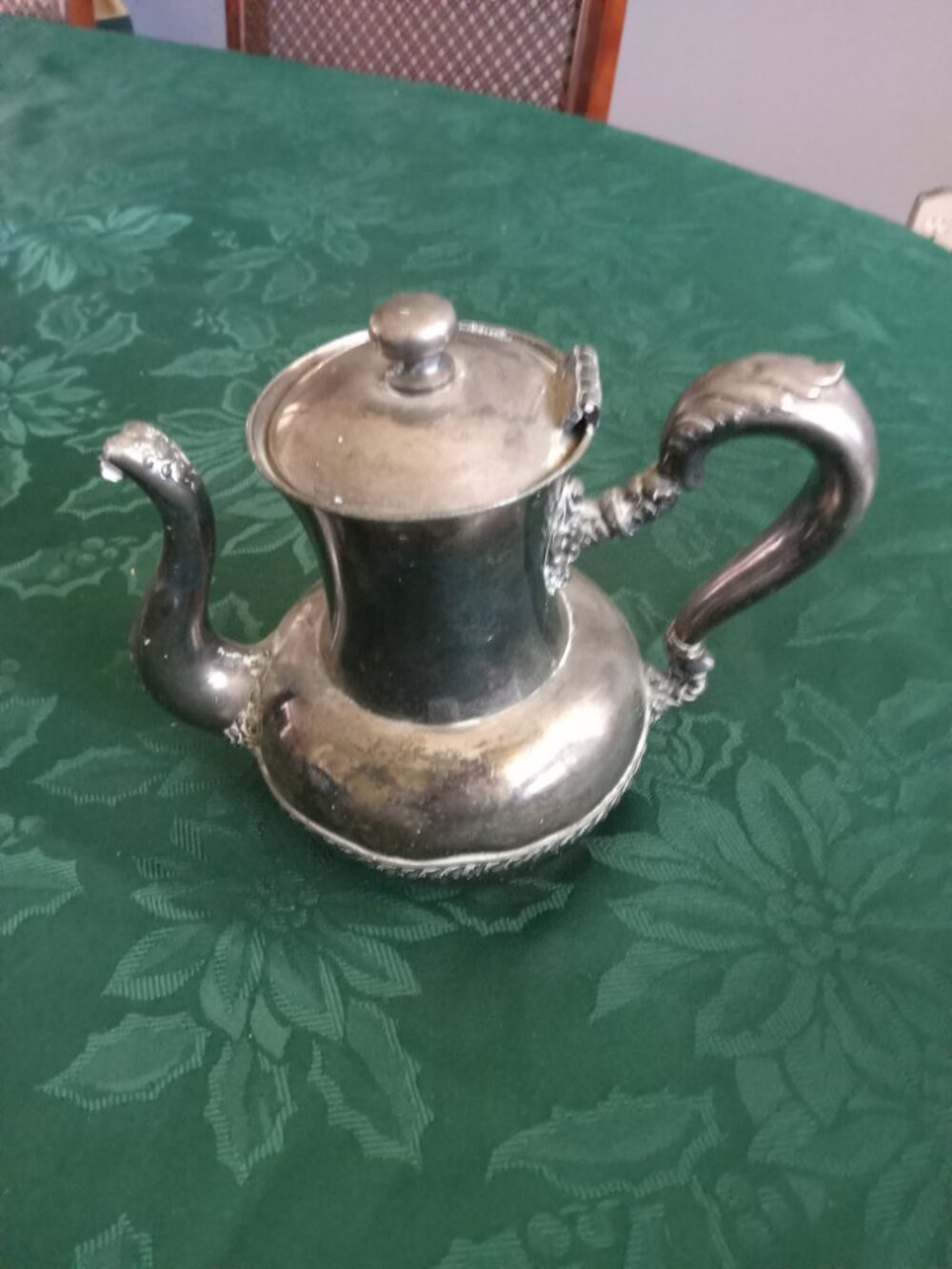 Vintage silver plate decorative tea pot with slightly dented spout